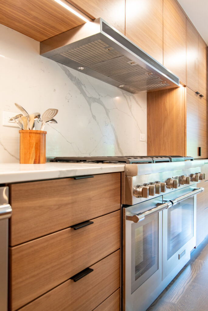 Deerfield Cohesive Contemporary Kitchen Remodel after 3. Photo of the new stove and accompanying countertop.