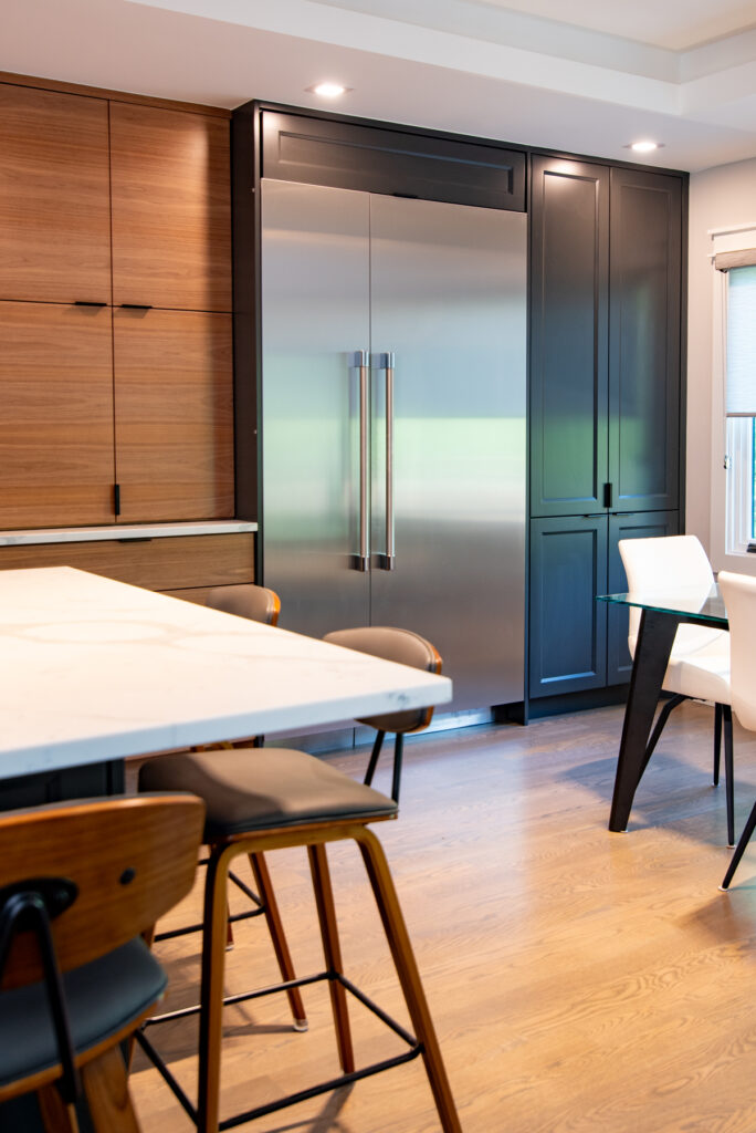 Deerfield Cohesive Contemporary Kitchen Remodel after 9. Photo of the dining area and fridge.