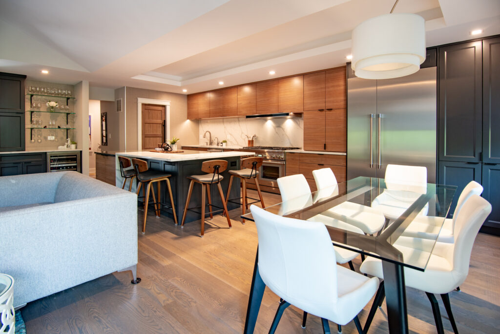 Deerfield Cohesive Contemporary Kitchen Remodel after 10. Photo of the entire remodeled kitchen from behind the table.