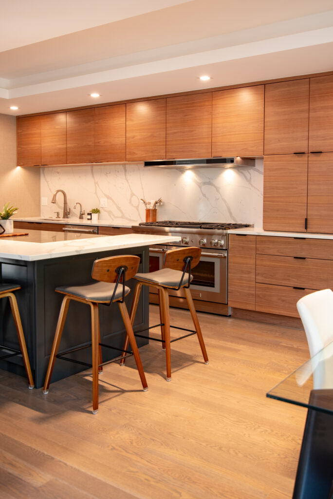 Deerfield Cohesive Contemporary Kitchen Remodel after 11. Photo of the dining area and island seating.