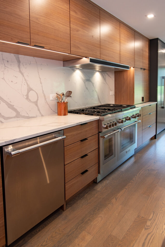 Deerfield Cohesive Contemporary Kitchen Remodel after 15. Photo of the counter space and stovetop.