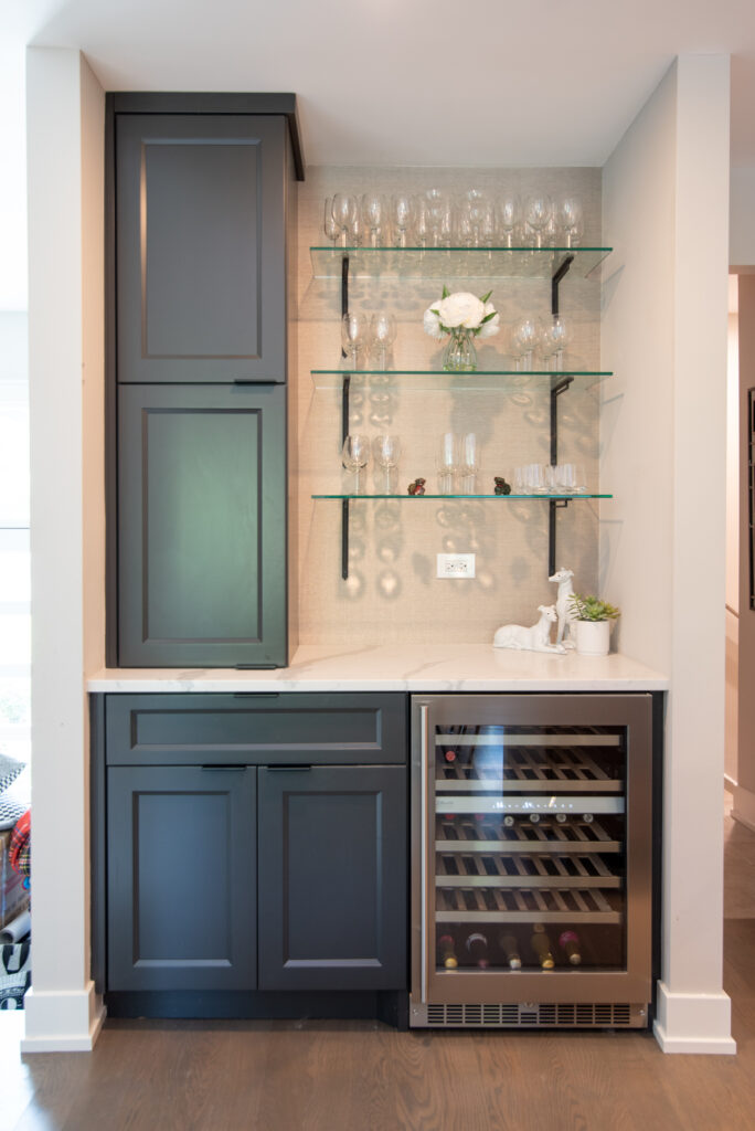 Deerfield Cohesive Contemporary Kitchen Remodel after 21. Photo of the custom glass wine glass rack.